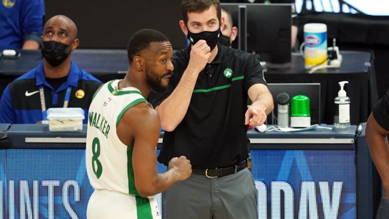 Feb 2, 2021; San Francisco, California, USA; Boston Celtics head coach Brad Stevens talks to guard Kemba Walker (8) during the fourth quarter against the Golden State Warriors at Chase Center. Mandatory Credit: Darren Yamashita-USA TODAY Sports