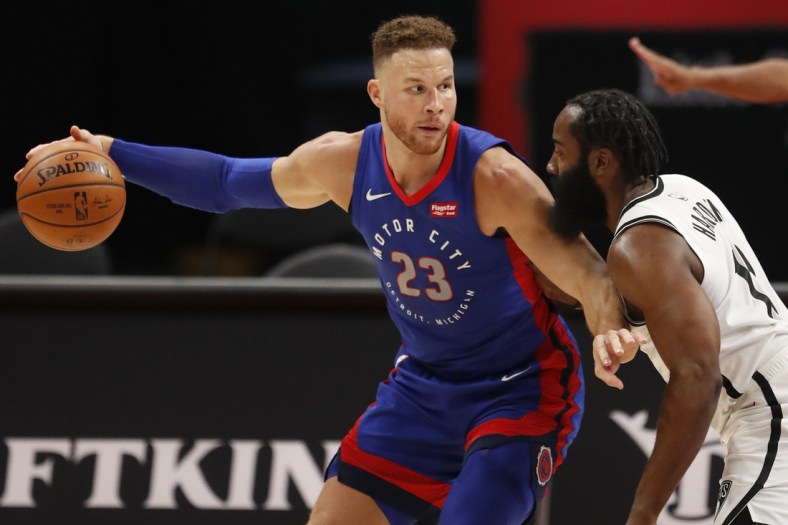 Feb 9, 2021; Detroit, Michigan, USA; Detroit Pistons forward Blake Griffin (23) controls the ball while defended by Brooklyn Nets guard James Harden (R) during the first quarter at Little Caesars Arena. Mandatory Credit: Raj Mehta-USA TODAY Sports