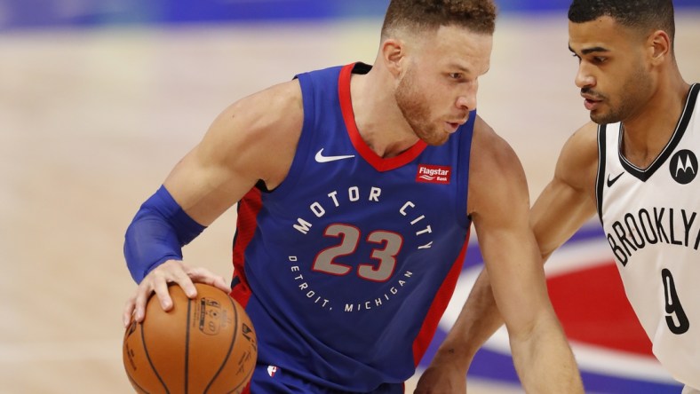 Feb 9, 2021; Detroit, Michigan, USA; Detroit Pistons forward Blake Griffin (23) dribbles the ball while defended by Brooklyn Nets guard Timothe Luwawu-Cabarrot (9) during the fourth quarter at Little Caesars Arena. Mandatory Credit: Raj Mehta-USA TODAY Sports