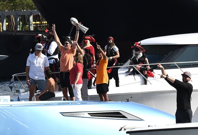 Feb 10, 2021; Tampa Bay, Florida, USA;   Tampa Bay Buccaneers quarterback Tom Brady celebrates with the Vince Lombardi Trophy on his boat during the  Tampa Bay Buccaneers boat parade to celebrate their victory over the Kansas City Chiefs in Super Bowl LV. Mandatory Credit: Jonathan Dyer-USA TODAY Sports