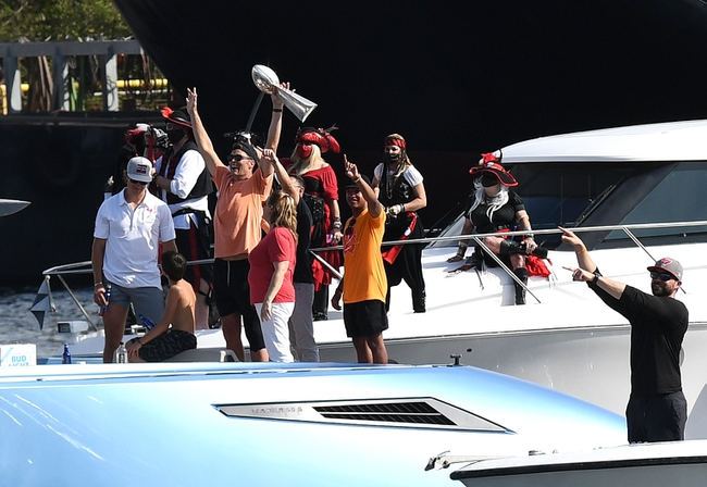 Feb 10, 2021; Tampa Bay, Florida, USA;   Tampa Bay Buccaneers quarterback Tom Brady celebrates with the Vince Lombardi Trophy on his boat during the  Tampa Bay Buccaneers boat parade to celebrate their victory over the Kansas City Chiefs in Super Bowl LV. Mandatory Credit: Jonathan Dyer-USA TODAY Sports