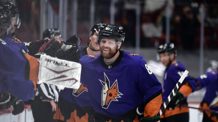 Feb 20, 2021; Glendale, Arizona, USA; Arizona Coyotes right wing Phil Kessel (81) celebrates a goal against the Los Angeles Kings during the third period at Gila River Arena. Mandatory Credit: Joe Camporeale-USA TODAY Sports