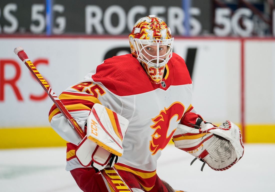 Feb 13, 2021; Vancouver, British Columbia, CAN; Calgary Flames goalie Jacob Markstrom (25) against the Vancouver Canucks in the first period at Rogers Arena. Vancouver won 3-1. Mandatory Credit: Bob Frid-USA TODAY Sports