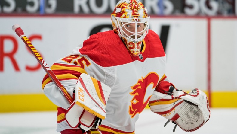 Feb 13, 2021; Vancouver, British Columbia, CAN; Calgary Flames goalie Jacob Markstrom (25) against the Vancouver Canucks in the first period at Rogers Arena. Vancouver won 3-1. Mandatory Credit: Bob Frid-USA TODAY Sports