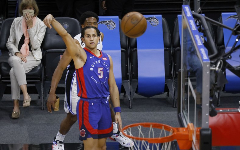 Feb 23, 2021; Orlando, Florida, USA;  Detroit Pistons guard Frank Jackson (5) shoots a three point basket during the first quarter against the Orlando Magic at Amway Center. Mandatory Credit: Reinhold Matay-USA TODAY Sports