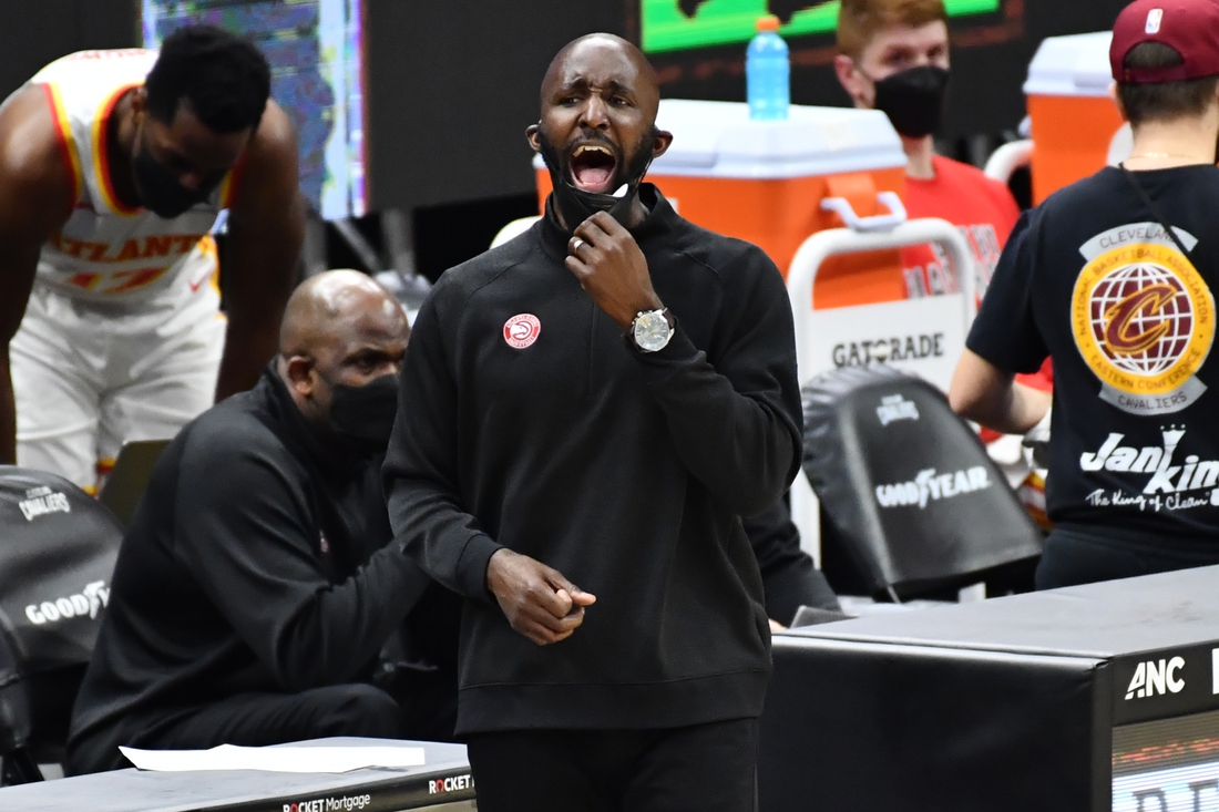 Feb 23, 2021; Cleveland, Ohio, USA; Atlanta Hawks head coach Lloyd Pierce yells to his team during the third quarter against the Cleveland Cavaliers at Rocket Mortgage FieldHouse. Mandatory Credit: Ken Blaze-USA TODAY Sports