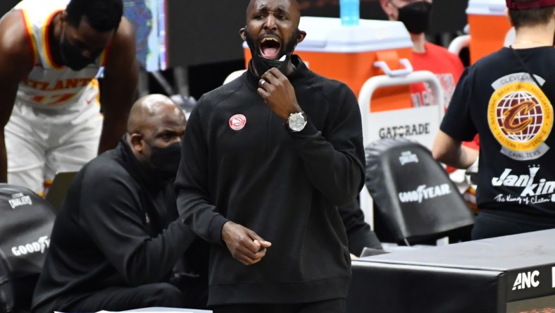 Feb 23, 2021; Cleveland, Ohio, USA; Atlanta Hawks head coach Lloyd Pierce yells to his team during the third quarter against the Cleveland Cavaliers at Rocket Mortgage FieldHouse. Mandatory Credit: Ken Blaze-USA TODAY Sports