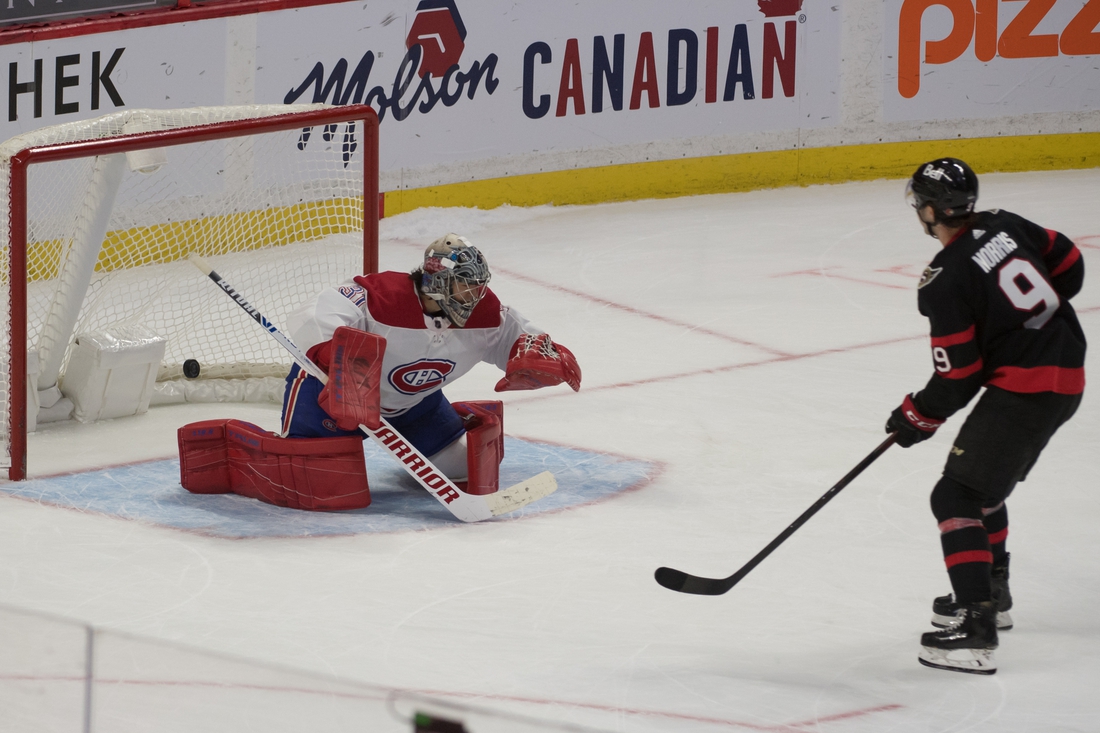 Feb 23, 2021; Ottawa, Ontario, CAN; Ottawa Senators center Josh Norris (9) scores against Montreal Canadiens goalie Carey Price (31) in a shootout at the Canadian Tire Centre. Mandatory Credit: Marc DesRosiers-USA TODAY Sports