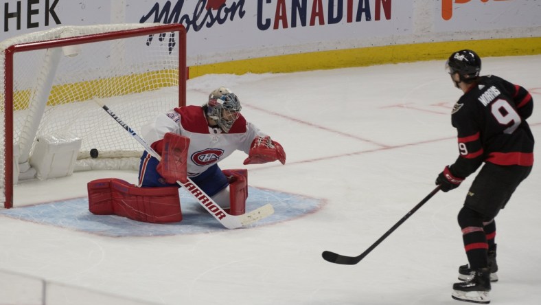 Feb 23, 2021; Ottawa, Ontario, CAN; Ottawa Senators center Josh Norris (9) scores against Montreal Canadiens goalie Carey Price (31) in a shootout at the Canadian Tire Centre. Mandatory Credit: Marc DesRosiers-USA TODAY Sports