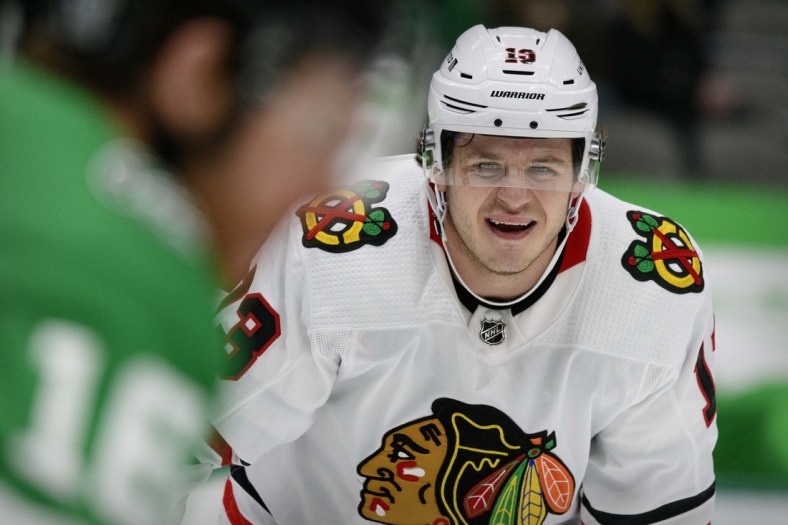 Feb 9, 2021; Dallas, Texas, USA; Chicago Blackhawks center Mattias Janmark (13) in action during the game between the Dallas Stars and the Chicago Blackhawks at the American Airlines Center. Mandatory Credit: Jerome Miron-USA TODAY Sports