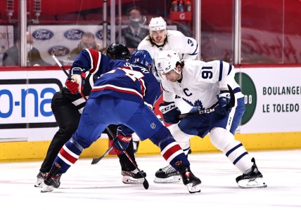 Feb 20, 2021; Montreal, Quebec, CAN; Montreal Canadiens center Nick Suzuki (14) and Toronto Maple Leafs center John Tavares (91) during a first period face-off at Bell Centre. Mandatory Credit: Jean-Yves Ahern-USA TODAY Sports