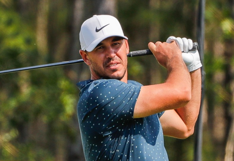 Feb 28, 2021; Bradenton, Florida, USA; Brooks Koepka plays his shot from the third tee during the final round of World Golf Championships at The Concession golf tournament at The Concession Golf Club. Mandatory Credit: Mike Watters-USA TODAY Sports
