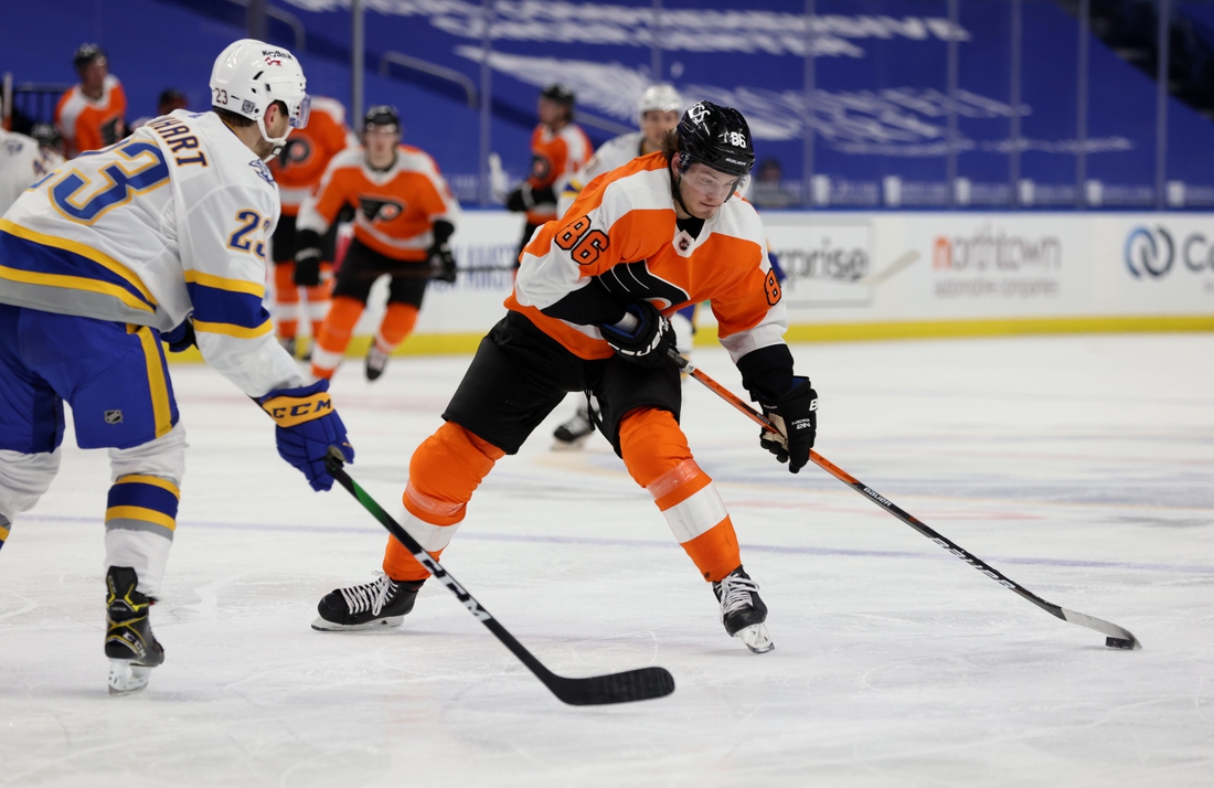 Feb 28, 2021; Buffalo, New York, USA; Buffalo Sabres center Sam Reinhart (23) looks to block a shot by Philadelphia Flyers left wing Joel Farabee (86) during the third period at KeyBank Center. Mandatory Credit: Timothy T. Ludwig-USA TODAY Sports