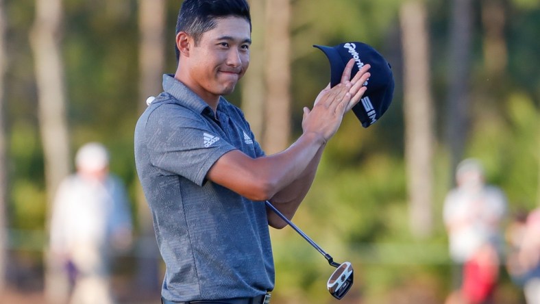 Feb 28, 2021; Bradenton, Florida, USA; Collin Morikawa celebrates after winning the World Golf Championships at The Concession golf tournament at The Concession Golf Club. Mandatory Credit: Mike Watters-USA TODAY Sports