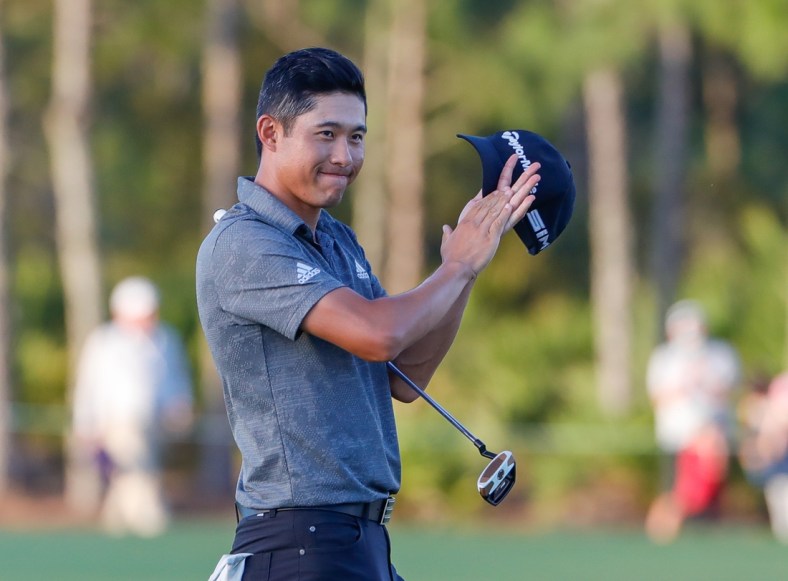 Feb 28, 2021; Bradenton, Florida, USA; Collin Morikawa celebrates after winning the World Golf Championships at The Concession golf tournament at The Concession Golf Club. Mandatory Credit: Mike Watters-USA TODAY Sports
