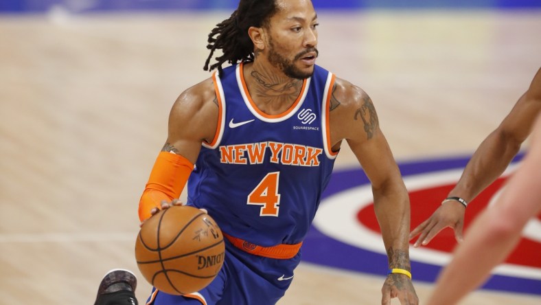 Feb 28, 2021; Detroit, Michigan, USA; New York Knicks guard Derrick Rose (4) dribbles the ball during the first quarter against the Detroit Pistons at Little Caesars Arena. Mandatory Credit: Raj Mehta-USA TODAY Sports