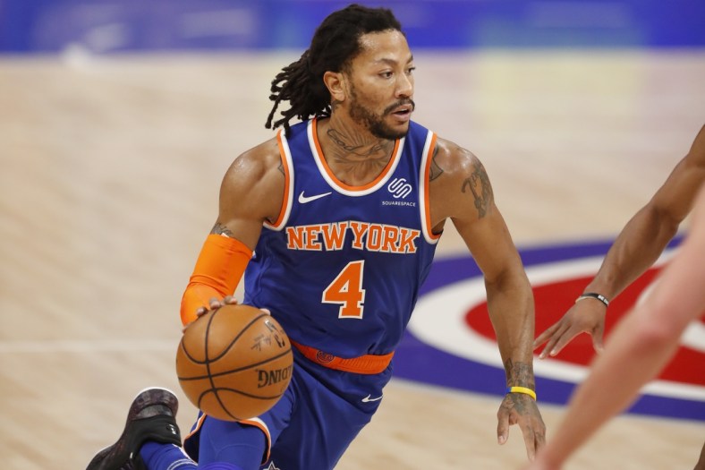 Feb 28, 2021; Detroit, Michigan, USA; New York Knicks guard Derrick Rose (4) dribbles the ball during the first quarter against the Detroit Pistons at Little Caesars Arena. Mandatory Credit: Raj Mehta-USA TODAY Sports
