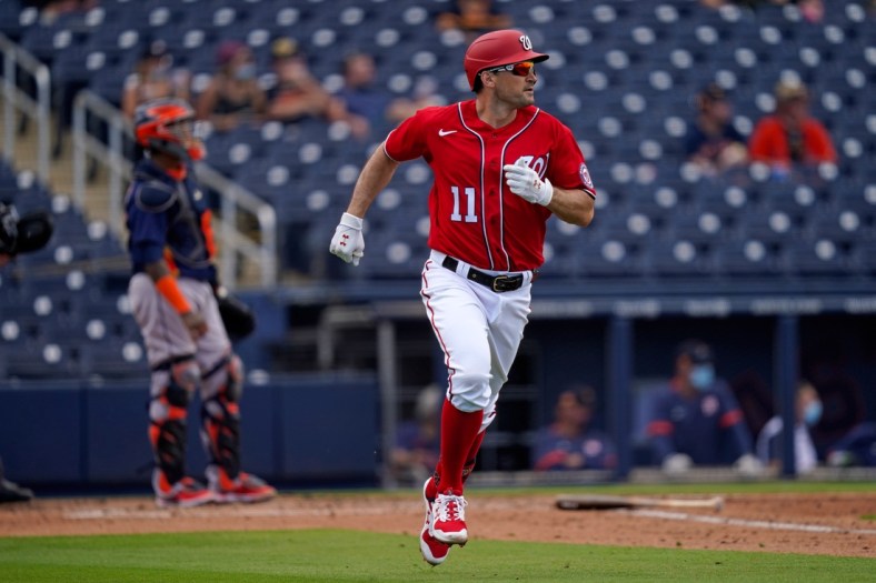 Mar 1, 2021; West Palm Beach, Florida, USA; Washington Nationals first baseman Ryan Zimmerman (11) rounds the bases after hitting a solo homerun in the 3rd inning of the spring training game against the Houston Astros at The Ballpark of the Palm Beaches. Mandatory Credit: Jasen Vinlove-USA TODAY Sports