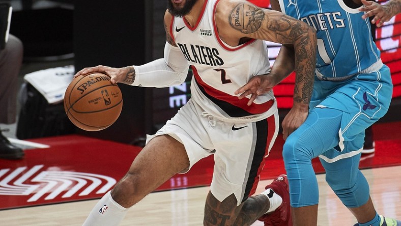 Mar 1, 2021; Portland, Oregon, USA; Portland Trail Blazers guard Gary Trent Jr. (2) drives past Charlotte Hornets guard Malik Monk (1) during the first half at Moda Center. Mandatory Credit: Troy Wayrynen-USA TODAY Sports