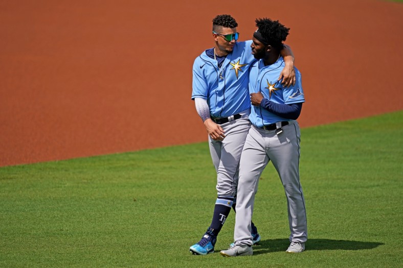 Mar 2, 2021; Fort Myers, Florida, USA; Tampa Bay Rays shortstop Willy Adames (L) and Tampa Bay Rays left fielder Randy Arozarena (R) walk to the dugout prior to the spring training game against the Boston Red Sox at JetBlue Park at Fenway South. Mandatory Credit: Jasen Vinlove-USA TODAY Sports