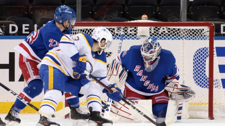 Mar 2, 2021; New York, New York, USA; New York Rangers goaltender Igor Shesterkin (31) blocks the net against Buffalo Sabres center Tobias Rieder (13) during the second period at Madison Square Garden. Mandatory Credit: Bruce Bennett-POOL PHOTOS-USA TODAY Sports