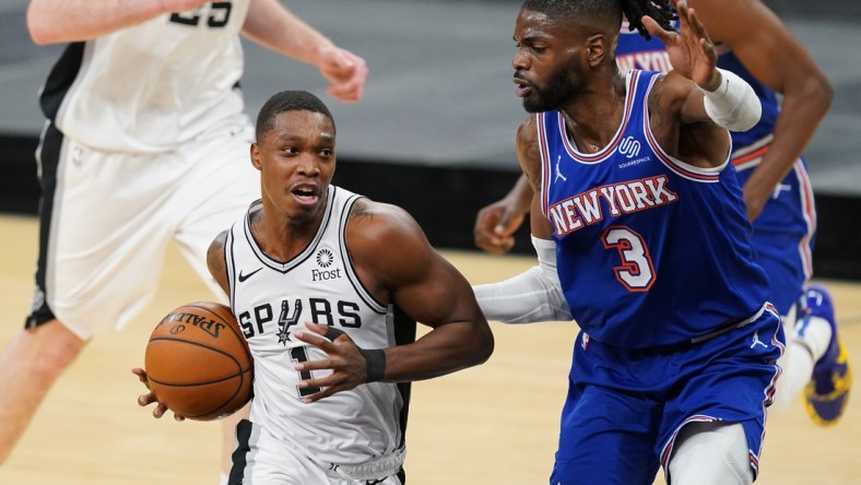 Mar 2, 2021; San Antonio, Texas, USA; San Antonio Spurs guard Lonnie Walker IV (1) dribbles the ball against New York Knicks center Nerlens Noel (3) in the first half at the AT&T Center. Mandatory Credit: Daniel Dunn-USA TODAY Sports