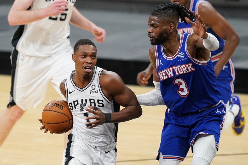 Mar 2, 2021; San Antonio, Texas, USA; San Antonio Spurs guard Lonnie Walker IV (1) dribbles the ball against New York Knicks center Nerlens Noel (3) in the first half at the AT&T Center. Mandatory Credit: Daniel Dunn-USA TODAY Sports