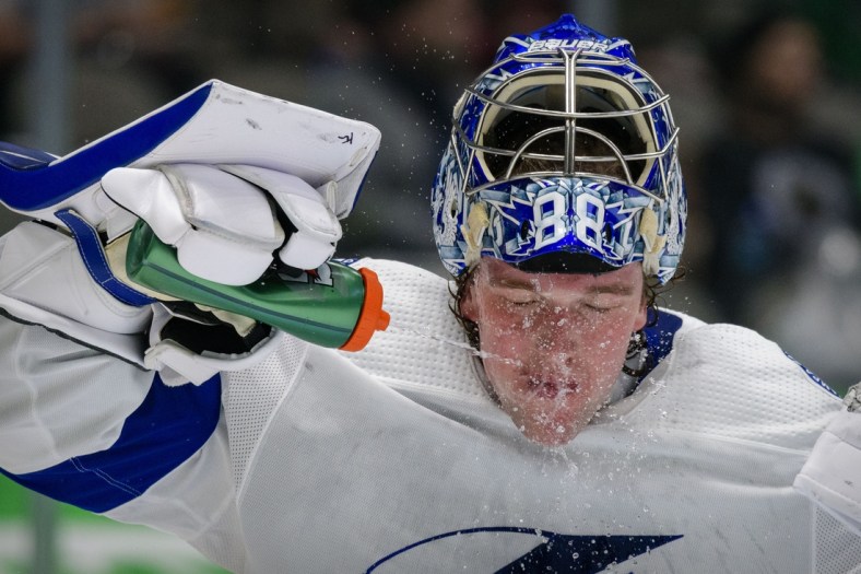 Mar 2, 2021; Dallas, Texas, USA; Tampa Bay Lightning goaltender Andrei Vasilevskiy (88) sprays off his face with water during the second period of the game between the Dallas Stars and the Tampa Bay Lightning at the American Airlines Center. Mandatory Credit: Jerome Miron-USA TODAY Sports