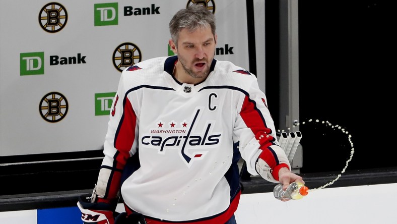 Mar 3, 2021; Boston, Massachusetts, USA; Washington Capitals left wing Alex Ovechkin (8) squirts a bottle before their game against the Boston Bruins at TD Garden. Mandatory Credit: Winslow Townson-USA TODAY Sports