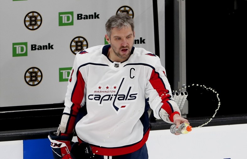 Mar 3, 2021; Boston, Massachusetts, USA; Washington Capitals left wing Alex Ovechkin (8) squirts a bottle before their game against the Boston Bruins at TD Garden. Mandatory Credit: Winslow Townson-USA TODAY Sports