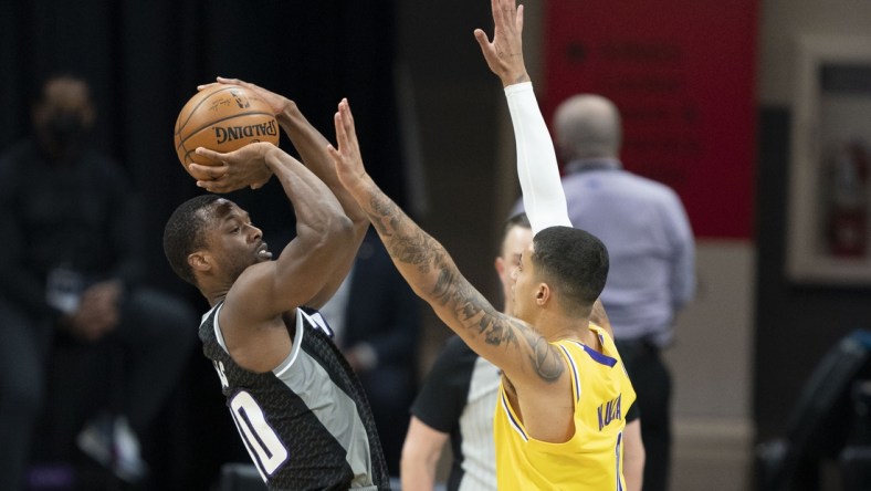 March 3, 2021; Sacramento, California, USA; Sacramento Kings forward Harrison Barnes (40) shoots the basketball against Los Angeles Lakers forward Kyle Kuzma (0)  during the first quarter at Golden 1 Center. Mandatory Credit: Kyle Terada-USA TODAY Sports