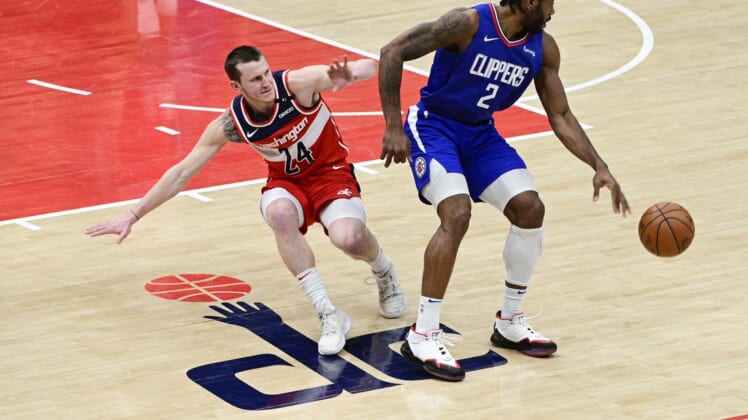 Mar 4, 2021; Washington, District of Columbia, USA;  LA Clippers forward Kawhi Leonard (2) spins away from Washington Wizards guard Garrison Mathews (24) during the second half at Capital One Arena. Mandatory Credit: Tommy Gilligan-USA TODAY Sports