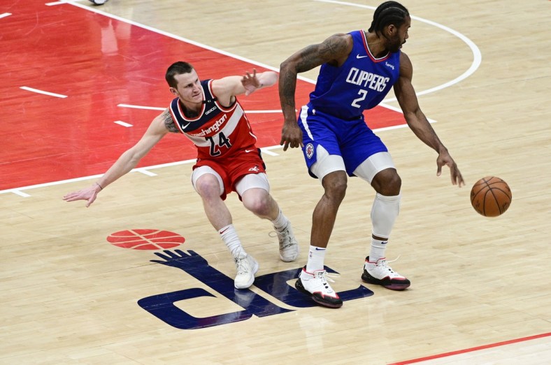 Mar 4, 2021; Washington, District of Columbia, USA;  LA Clippers forward Kawhi Leonard (2) spins away from Washington Wizards guard Garrison Mathews (24) during the second half at Capital One Arena. Mandatory Credit: Tommy Gilligan-USA TODAY Sports