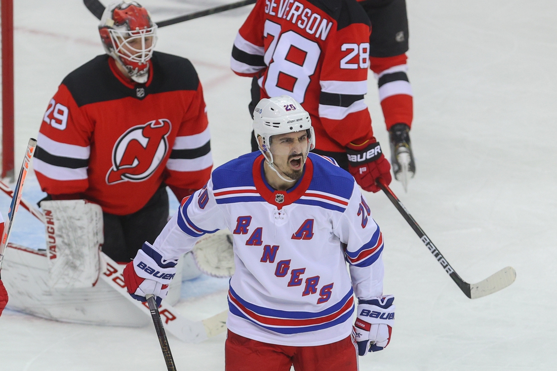 New York Rangers' Chris Kreider (20) celebrates his goal with