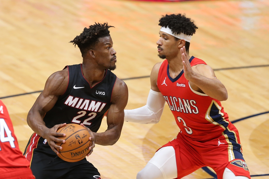 Mar 4, 2021; New Orleans, Louisiana, USA; Miami Heat forward Jimmy Butler (22) handled the ball while defended by New Orleans Pelicans guard Josh Hart (3) in the first quarter at the Smoothie King Center. Mandatory Credit: Chuck Cook-USA TODAY Sports