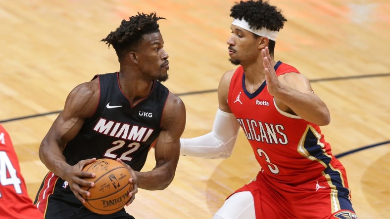 Mar 4, 2021; New Orleans, Louisiana, USA; Miami Heat forward Jimmy Butler (22) handled the ball while defended by New Orleans Pelicans guard Josh Hart (3) in the first quarter at the Smoothie King Center. Mandatory Credit: Chuck Cook-USA TODAY Sports