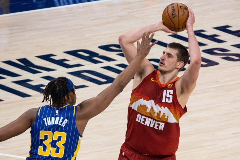Mar 4, 2021; Indianapolis, Indiana, USA; Denver Nuggets center Nikola Jokic (15) shoots the ball while Indiana Pacers center Myles Turner (33) defends in the third quarter at Bankers Life Fieldhouse. Mandatory Credit: Trevor Ruszkowski-USA TODAY Sports