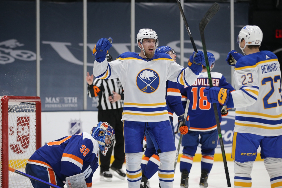 Mar 4, 2021; Uniondale, New York, USA; Buffalo Sabres defenseman Rasmus Ristolainen (55) celebrates with center Sam Reinhart (23) after scoring a goal against New York Islanders goalie Ilya Sorokin (30) during the third period at Nassau Veterans Memorial Coliseum. Mandatory Credit: Brad Penner-USA TODAY Sports