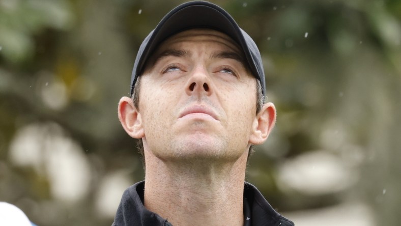 Mar 6, 2021; Orlando, Florida, USA; A light rain falls as Rory McIlroy prepares to hit his drive on the first hole during the third round of the Arnold Palmer Invitational golf tournament at Bay Hill Club & Lodge. Mandatory Credit: Reinhold Matay-USA TODAY Sports