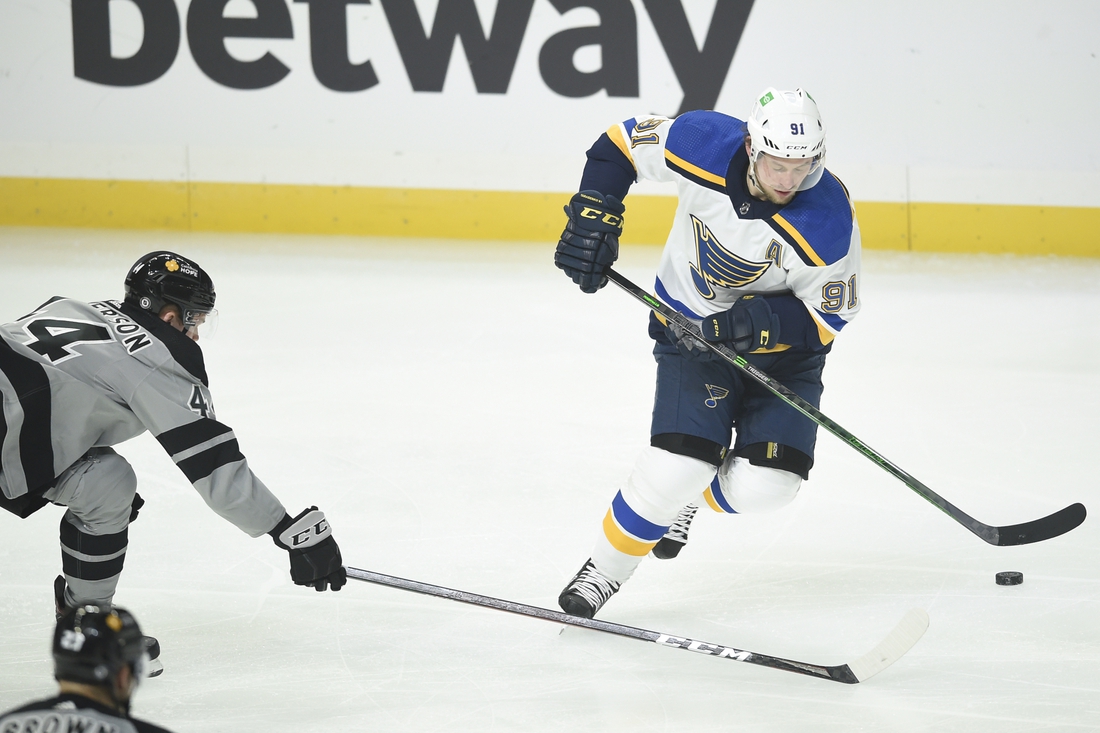 Mar 6, 2021; Los Angeles, California, USA; St. Louis Blues right wing Vladimir Tarasenko (91) handles the puck while Los Angeles Kings defenseman Mikey Anderson (44) defends during the second period at Staples Center. Mandatory Credit: Kelvin Kuo-USA TODAY Sports