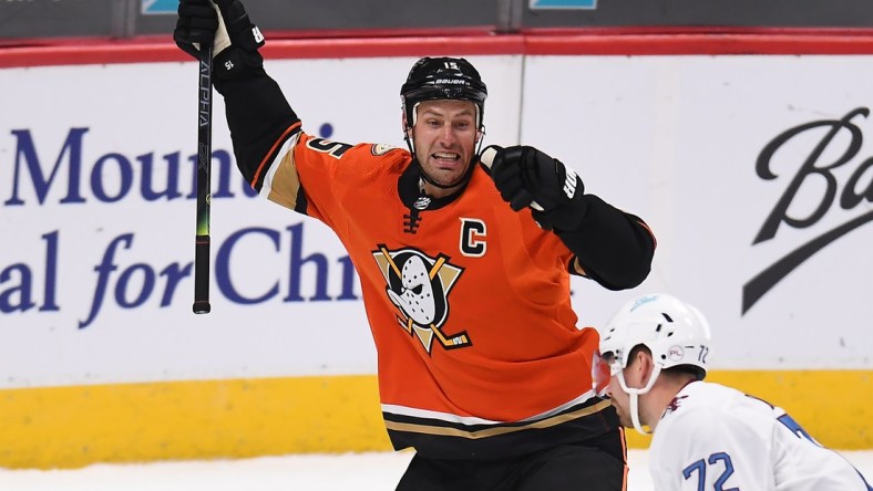 Mar 6, 2021; Denver, Colorado, USA; Anaheim Ducks center Ryan Getzlaf (15) celebrates after scoring the overtime winning goal against the Colorado Avalanche at Ball Arena. Mandatory Credit: Ron Chenoy-USA TODAY Sports