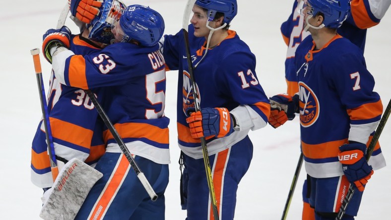 Mar 7, 2021; Uniondale, New York, USA; New York Islanders center Casey Cizikas (53) hugs goalie Ilya Sorokin (30) after defeating the Buffalo Sabres 5-2 at Nassau Veterans Memorial Coliseum. Mandatory Credit: Brad Penner-USA TODAY Sports