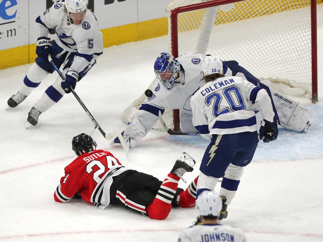 Mar 7, 2021; Chicago, Illinois, USA; Tampa Bay Lightning goaltender Andrei Vasilevskiy (88) makes a save on a shot from Chicago Blackhawks center Pius Suter (24) during the first period at the United Center. Mandatory Credit: Dennis Wierzbicki-USA TODAY Sports