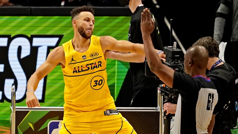 Mar 7, 2021; Atlanta, Georgia, USA;  Golden State Warriors guard Stephen Curry (30) celebrate after winning the NBA All-Star 3 Point Contest at State Farm Arena. Mandatory Credit: Dale Zanine-USA TODAY Sports