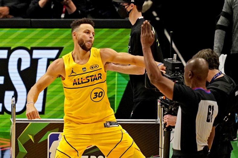 Mar 7, 2021; Atlanta, Georgia, USA;  Golden State Warriors guard Stephen Curry (30) celebrate after winning the NBA All-Star 3 Point Contest at State Farm Arena. Mandatory Credit: Dale Zanine-USA TODAY Sports