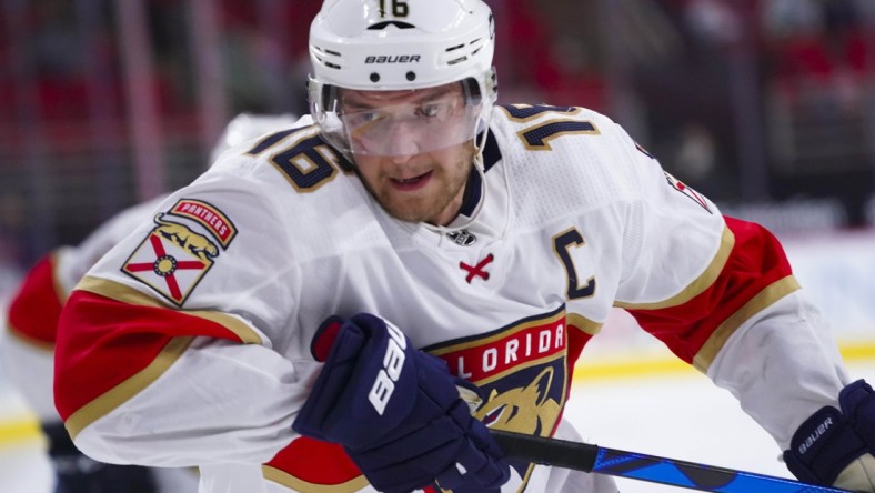 Mar 7, 2021; Raleigh, North Carolina, USA;  Florida Panthers center Aleksander Barkov (16) skates against the Carolina Hurricanes during the third period at PNC Arena. Mandatory Credit: James Guillory-USA TODAY Sports