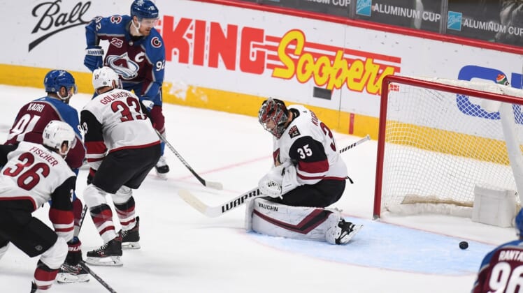 Mar 8, 2021; Denver, Colorado, USA; Arizona Coyotes goaltender Darcy Kuemper (35) allows a goal in the second period against the Colorado Avalanche at Ball Arena. Mandatory Credit: Ron Chenoy-USA TODAY Sports