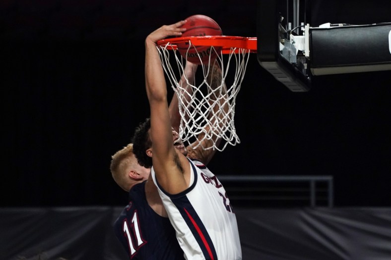Mar 8, 2021; Las Vegas, NV, USA; Gonzaga Bulldogs forward Anton Watson (22) dunks the ball over St. Mary's Gaels forward Matthias Tass (11) in the second half of a West Coast Conference tournament semifinal at Orleans Arena. Gonzaga defeated St. Mary's 78-52.  Mandatory Credit: Kirby Lee-USA TODAY Sports