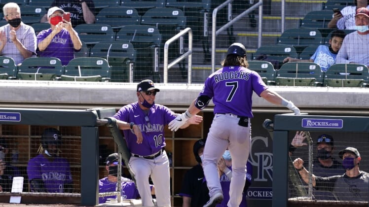 Mar 9, 2021; Scottsdale, Arizona, USA; Colorado Rockies manager Bud Black reacts after Brendan Rodgers (7) scored on a Dom Nu ez RBI-single against the Arizona Diamondbacks in the fourth inning during a spring training game at Salt River Fields at Talking Stick. Mandatory Credit: Rob Schumacher-Arizona Republic