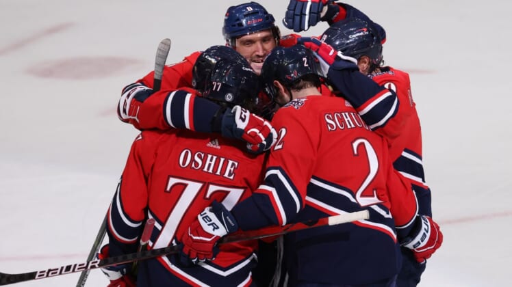 Mar 9, 2021; Washington, District of Columbia, USA; Washington Capitals right wing T.J. Oshie (77) celebrates with teammates after scoring goal against the New Jersey Devils in the first period at Capital One Arena. Mandatory Credit: Geoff Burke-USA TODAY Sports